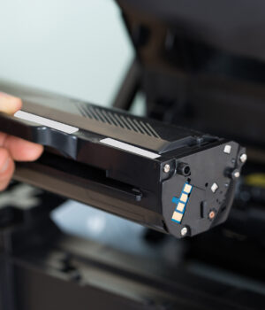 Businessman Fixing Cartridge In Photocopy Machine